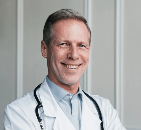 Medical professional recommending topical nail treatments